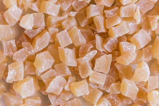 Sweet candied ginger cubes background