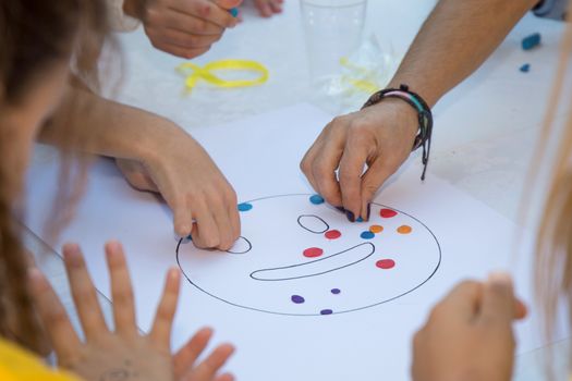 Kids playing with plasticine