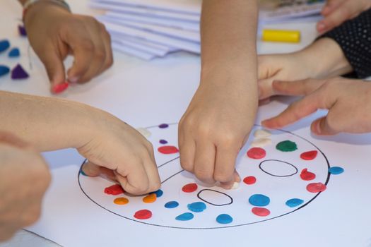 Kids playing with plasticine