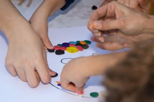 Kids playing with plasticine