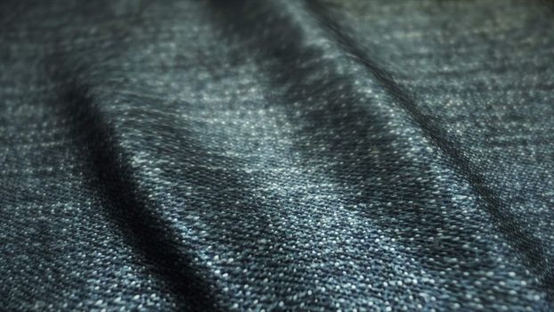 Realistic jeans waving in the wind. Abstract background Ultra-HD resolution. Close-up fabric texture. Seamless loop.