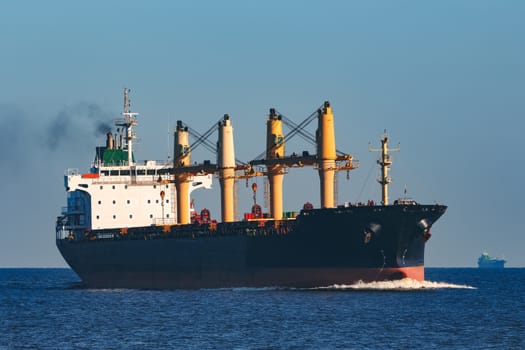 Black cargo ship sailing from the Baltic sea