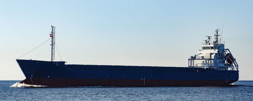 Blue cargo ship sailing from the Baltic sea