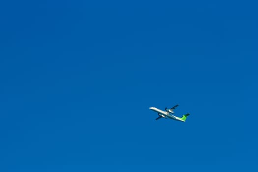 Passenger aircraft flying in the blue sky