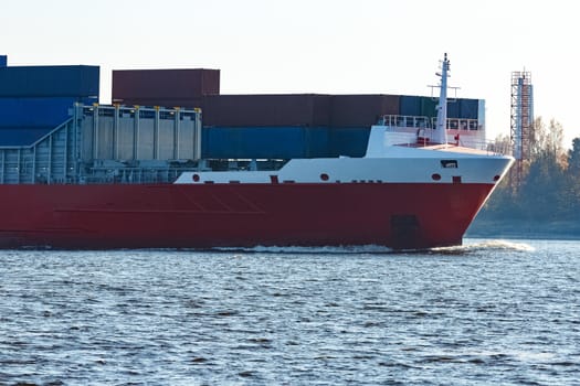 Red container ship sailing to the Baltic sea