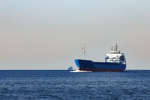 Blue cargo ship sailing from the Baltic sea