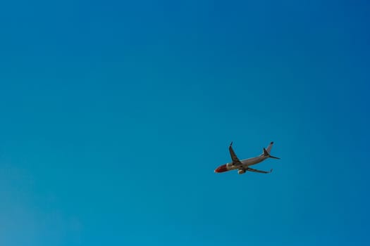 Passenger aircraft flying in the blue sky