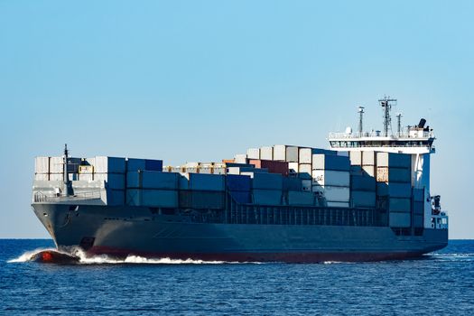 Large grey container ship moving from Baltic sea