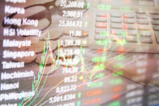 Business or finance concept : Double exposure of stock exchange market graph chart and stocks data on monitor on money and saving account passbook background