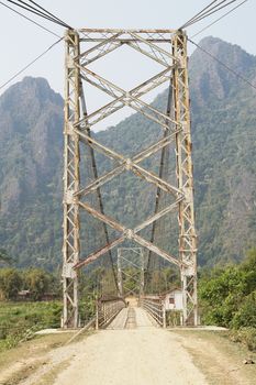 Old chain bridge crossing a river close to Vang Vieng, Laos, Asia