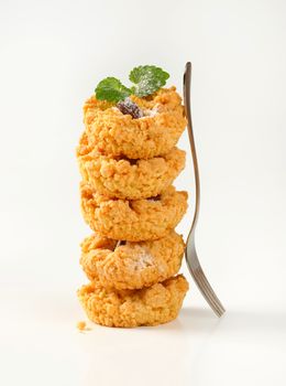 Stack of almond crumb cookies on  white background