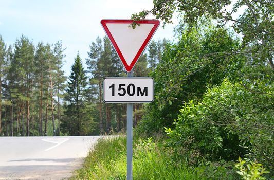 Road sign on the edge of slopes