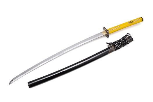 Japanese sword and scabbard on white background wrapped handle by yellow leather  and ray skin on scabbard