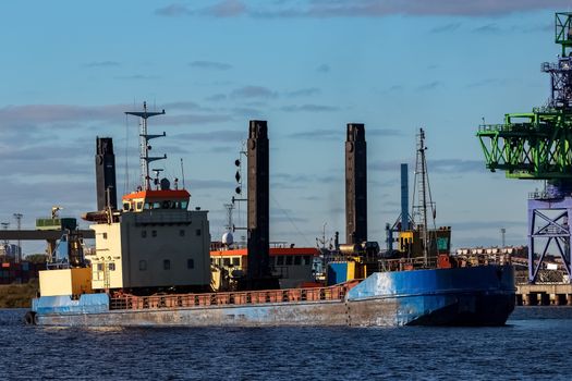 Blue cargo ship in the port of Riga, Europe