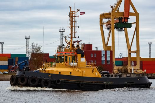 Tug ship in the cargo port of Riga, Europe