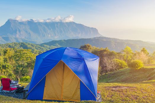 Camping tent in campground on top of mountain with sunrise at Doi Luang Chiang Dao, ChiangMai Thailand.