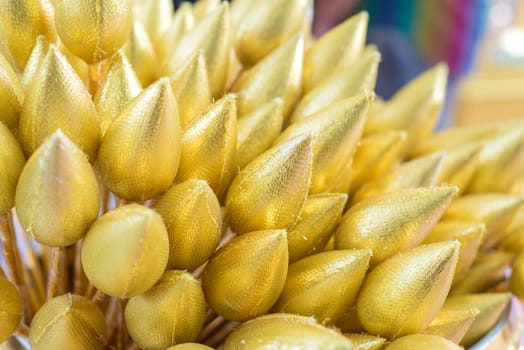 Artificial gold lotus on vase for sacrifice to buddha.