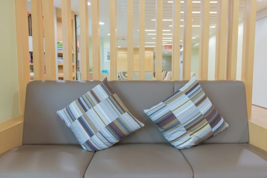decorative of pillows on casual sofa in living room.
