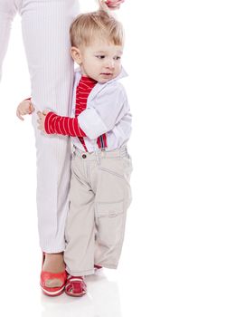 Son holding mother's leg isolated on white