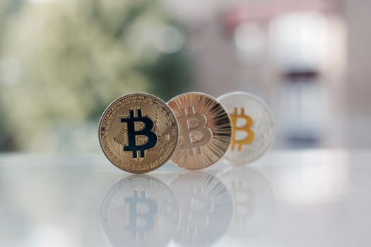 Digital currency physical gold and silver bitcoins on the table.