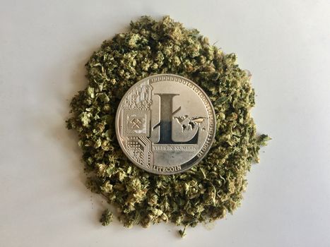 Digital currency physical silver litecoin coin on the marijuana