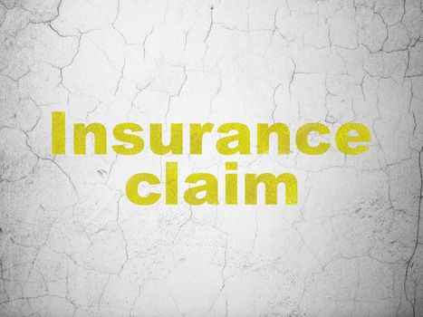 Insurance concept: Yellow Insurance Claim on textured concrete wall background