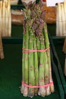 Bundle bunch of fresh green garden asparagus shoots close up, elevated high angle view