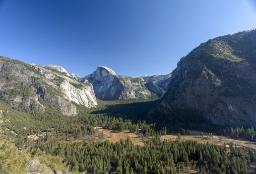 A view from the Yosemite's valley floor looking Southeast to Half Dome. Yosemite is home to waterfalls, granite peaks, and beautiful meadow. This was taken on a very warm summer day in August.
