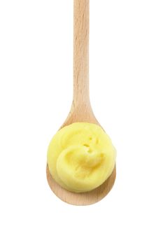 swirl of potato puree on wooden spoon