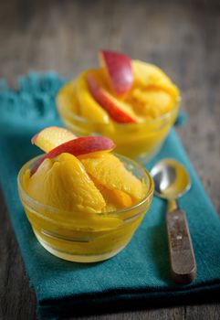 Home made mango ice sorbet with peach slices