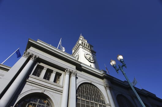 A vertical look at San Francisco's Ferry Building located on the Embarcadero along the waterfront. The Ferry Building hosts restaurants, and little boutique shops.