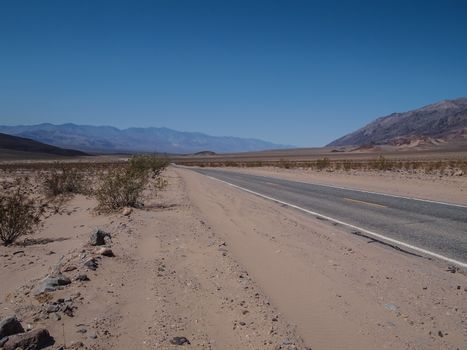 Driving through the desert in Death Valley National Park , USA