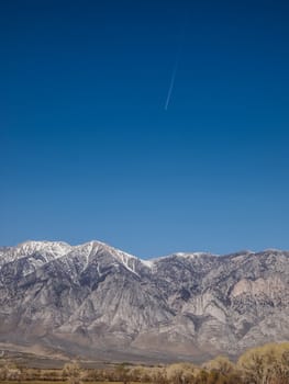Snow capped mountains, blue sky, Desert landscape in California , USA