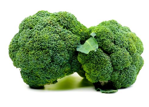 Two Perfect Raw Fresh Broccoli with Leaf closeup on White background