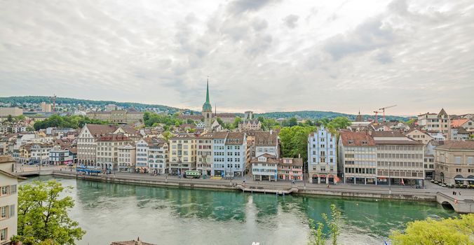 Zurich, Switzerland - June 10, 2017: Street Limmatquai, downtown Zuerich, view from park Lindenhof. River Limmat in front.
