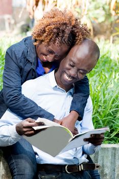 This young couple is happy to be together that day in the park.