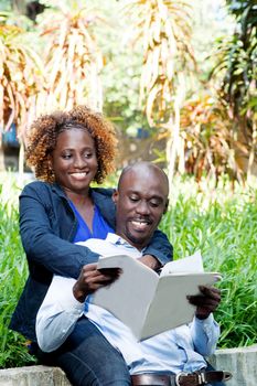 young couple embracing in a park devoted himself to the game.