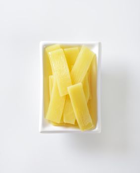 bowl of bamboo shoot slices on white background