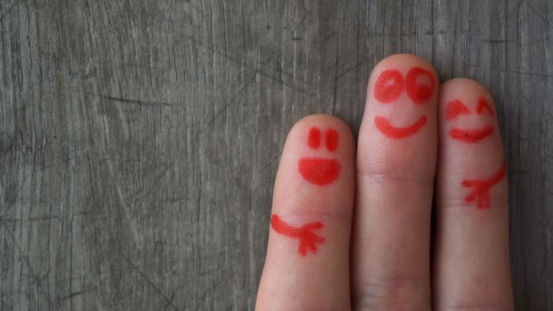 happy fingers.beautiful faces painted on the toes.