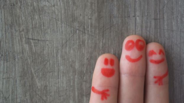 happy fingers.beautiful faces painted on the toes.