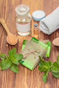 Green mint handmade soap on a wooden background