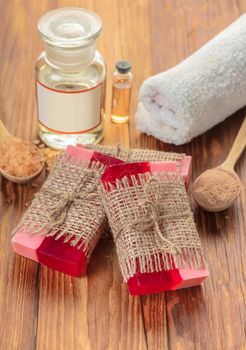 Red handmade fruit soap on a wooden background