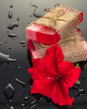 Handmade soap red with a flower on black background