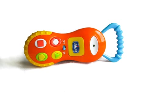 children's toy orange telephone isolated on white background with shadow