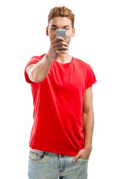 Handsome young man making a selfie, isolated over a white background