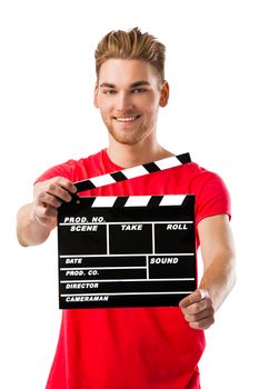 Portrait of a handsome young man wolding a clapboard