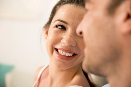 Portrait of a young couple looking to each other