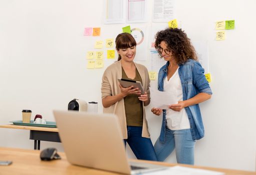 Shot of two businesswoman working together in an office