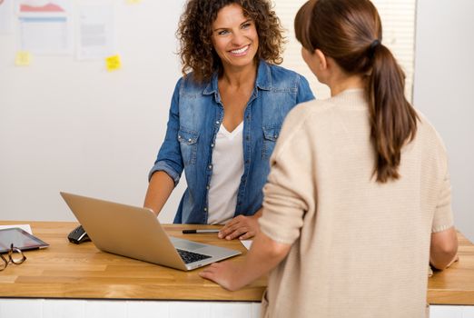 Shot of two businesswoman working together in an office