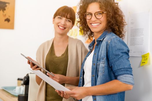 Shot of two businesswoman working together in an office